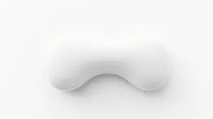 Fotografia profissional de um travesseiro cervical ortopédico com design ergonômico, ideal para o alívio de dores no pescoço.